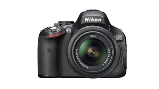 Grip a Nikon D5100 Digital SLR Camera with 18-55mm VR Lens for $580